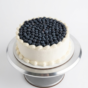 celebration cakes 10 inch cake topped with blueberries (buttercream frosting)